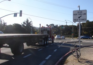 SIGN - by big truck) Camino Aguajito yield to bikes (2)