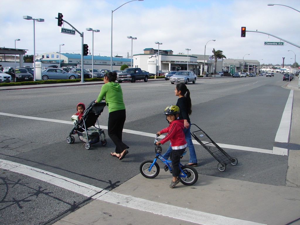 Seaside - young biker with moms in crosswalk