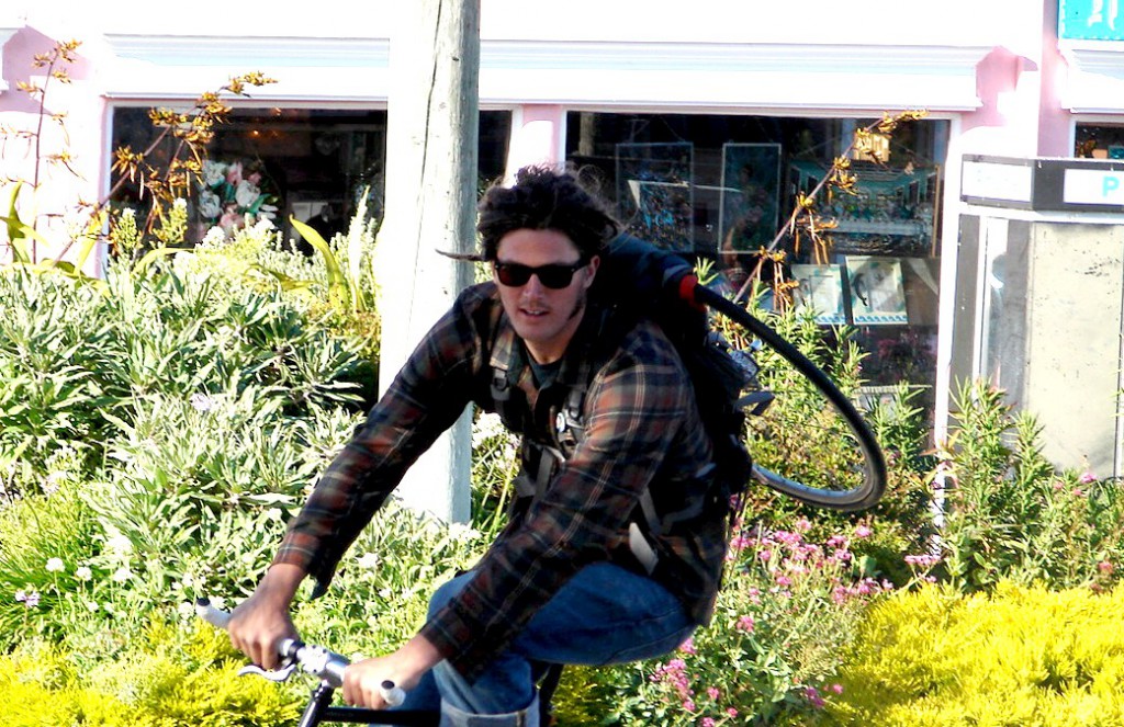 Biker with tire on back