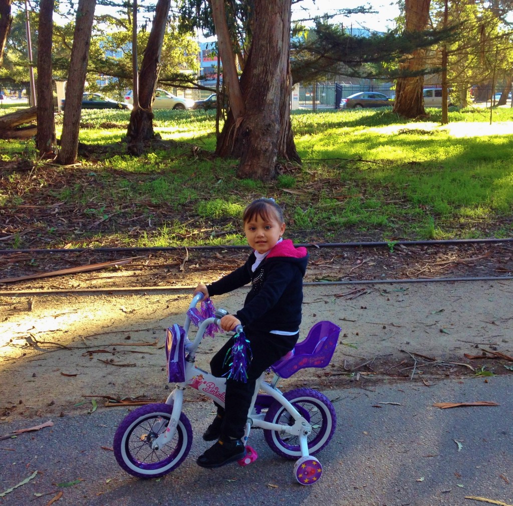 Girl with baby carrier rails to trails